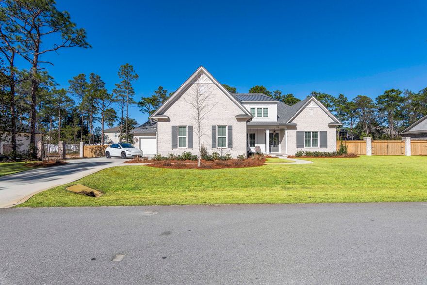 Welcome to Hunters Run situated in South Walton County minutes from the Sugar White Sand Beaches along our Gulf of Mexico coastline. This is a New Randy Wise Development with Oversized Lots in a Gated Community. This 2022 Custom built 4 Br 4.5 Ba, bonus area could also be used as a bed room, right now its set up with two twin bunkbeds and sectional, it also has its own bathroom.  This House comes move in ready with brand new Custom Furnishings and Decor. All of this has been purchased within the last few months. Every Room in the house has been furnished and decorated. The Residence is energy efficient and the Foam Insulation keeps the power Bills to a minimum. There is a Telsa/EV charger also installed in the Garage. Master and office are on one side of the house while 3 other bedrooms, along with two full baths are on the other. All-Brick Craftsman Home, 3 car Garage, Outdoor Kitchen with plenty of space for entertaining., Upon Arrival which starts at your raised elevation Front Porch lit by Bronze Gas Lanterns and Framed with a Glass & Custom Mahogany Wood Front Door with spacious entryway. Old Chicago style Brick Archways lead you into the Main Living Area which is an Open Floorplan concept with the Living, Dining and Gourmet Kitchen all working together to create the Perfect Harmony for the Ultimate Entertaining Space. Cambria Quartz Countertops, Stainless Steel Appliances and an Oversized Commercial Frigidaire Fridge/Freezer.   House is being sold fully furnished. Privacy is provided by your Custom Wood and Brick Fencing, serenity abounds with your Green Zoysia Grass, Professional Landscaping. This home has everything the Modern Family could require all the while doing it seamlessly with an Amazing Floorplan design.
