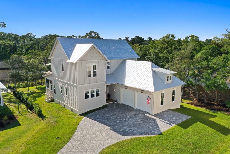 Welcome to this beautiful waterfront home located on an oversized corner lot with maximum curb appeal in a fantastic development! Constructed by Paradise Coastal Builders in 2021, this large, 4 Bed, 4.5 bath, two-story residence is the perfect family home, thoughtfully designed with style, functionality, and the SoWal lifestyle in mind. The property boasts breathtaking views of Musset Bayou and Choctawhatchee Bay from nearly every room, making it an ideal place to call home and create unforgettable memories. Step inside and be welcomed by a gourmet kitchen featuring KitchenAid appliances, quartz countertops & backsplash, pot filler, farm sink, and custom hood vent & cabinetry. The oversized kitchen island is a great centerpiece and gathering spot, perfect for hosting a dinner party or