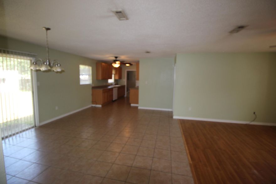 Brick home in DeFuniak Springs near Back Lake. Open, Split floor plan with hardwood laminate floors in the living room. Ceramic tile floors in the dining room and kitchen area. The master bedroom is roomy and has an attached bonus room that is 10'x9'. Two car carport and fenced-in back yard. The exterior of the home needs a little TLC, but the home is priced to move.