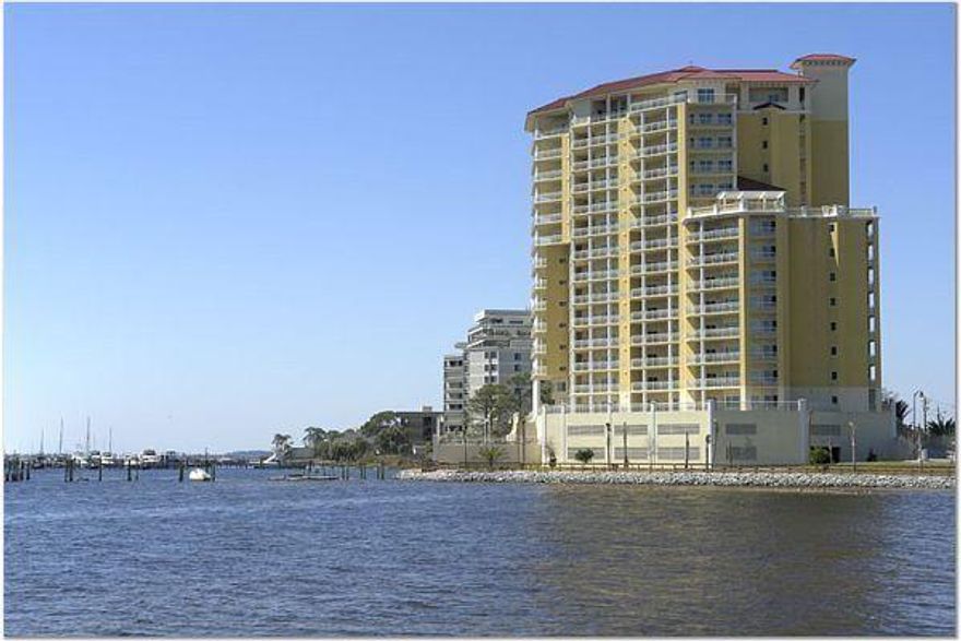Spacious and well maintained unit on the 11th floor with glorious views of the Intercoastal Water Way (Sound) and the Gulf of Mexico!  With tile flooring throughout and attention to detail in every room.  Each bedroom has it own full bath with one bedroom sharing the bath with a hall way access. With balcony access from both the living room and the Master Bedroom, this is waterfront living at it's finest.  Gate and door codes keep the property secure and two floors of parking make it convenient.  From the large community pool and boat/fishing dock on the exterior to the workout room, media room and party room available for owner's use.  Storage Room #11-C.  Parking Slots #66 and #74This is HOME!