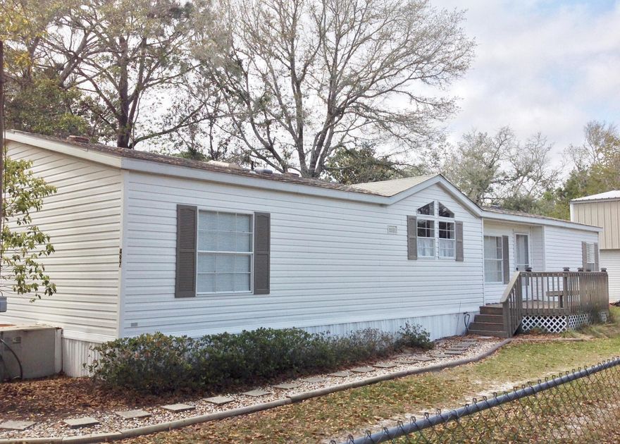 Country Living Near the City. Paradise found! You will love this spacious home with open, split bedroom floor plan with Fireplace and vaulted ceilings. The kitchen will steal the chef's heart. Truly! It's huge with tons of cabinets, a breakfast bar, wet bar, computer/meal planning desk, island, and sunny window above the sink. The Dining room has sliding doors leading to large, covered deck. Perfect for entertaining. Master bedroom suite boasts huge walk in closet. Master bath has soaking tub, separate shower with 2 seats, and additional closet entrance. There are 2 additional bedrooms, full bath and Laundry room on the other side. The ''Monster RV Garage'' will WOW you! Boasting 1,260 sf! Park your RV + 3 cars, boat, etc. here. Has a work shop & loft too. MUST SEE! You will LOVE it here.