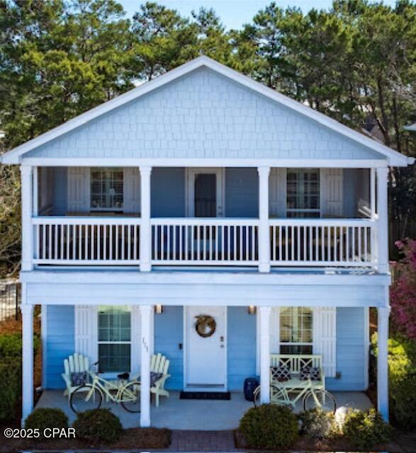 FABULOUS JEWEL IN QUIET INLET BEACH NEIGHBORHOOD, MINUTES TO THE GULF! This beautiful, fully furnished home, offers the perfect combination of comfort, style and an unbeatable location. Just minutes from the beach using the new Inlet Beach Underpass and steps away from the exquisite restaurants and shops of 30Avenue. The lovely, quiet neighborhood of West Shore Place offers a wonderful community pool that is meticulously maintained and heated in the cooler months. This property is the ultimate turnkey investment or second home. Inside, you will find a spacious open floor plan with three bedrooms, beautifully designed kitchen and living space. This house is perfect for entertaining with family & friends. The home is thoughtfully furnished, making it ready for immediate enjoyment. The many upgrades of this home include impact resistant glass windows, custom plantation shutters, crown molding throughout, granite countertops, 8x24' covered front porch, irrigation system, oversized brick pavered driveway, outside storage closet, just to mention a few. The spacious kitchen with tons of storage and counterspace along with a large pantry, is perfect for cooking and entertaining. All appliances are included along with the beverage refrigerator located in the pantry. The outdoor living areas are equally inviting with a very private large deck that has a pergola with ceiling fan and privacy wall. This property backs up to a privately owned half acre that gives you coveted privacy while enjoying your deck. You will also find a 8x24 covered, screened in balcony off of the master bedroom. This balcony is perfect for watching the sunset. Don't miss this opportunity for a true piece of paradise! AGE, ROOM SIZES, SQ FOOTAGE AND LOT SIZE ARE ESTIMATES. PLEASE MEASURE IF CONCERNED.