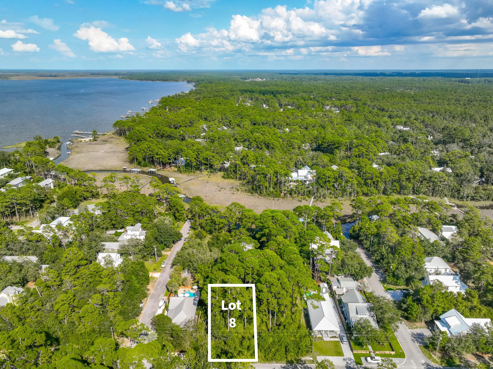 This lot offers the perfect blend of bay access, natural beauty, and 30A convenience - just a few streets from Choctawhatchee Bay, where you'll find a community dock and a nearby county park for kayaking, fishing, and sunset views. Less than four miles away, Grayton Beach awaits, separated only by the quiet of Point Washington State Forest. Just around the corner, Eden Gardens State Park invites you to explore its scenic trails, picnic pavilion, and grills for a true taste of Old Florida charm. This growing community of classic Florida cottages offers rare freedom, no HOA and no buildout timeline - giving you complete control over your home's design.Want more space? The adjacent .17-acre lot is also available, allowing you to combine both properties for an expansive homesite perfectly suited for a custom coastal retreat, pool, and outdoor living. With WaterColor, Seaside, and all the best dining and shopping along 30A just minutes away, this is your chance to create a private sanctuary in one of South Walton's most peaceful settings.
Lots 7 & 8 include wetlands but are recognized as buildable lots of record by Walton County. Pricing reflects the presence of wetlands and associated considerations. Wetland study available.