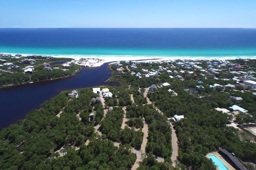 Located in the west peninsula of Draper Lake Coastal Village, this corner lot backs up to a scenic path leading directly to the pedestrian bridge over Draper Lake. It offers exceptional privacy with only one neighbor. Set so close to the bridge, neighborhood amenities on either gated peninsula are within easy reach. Closest is the 40-foot observation tower capturing panoramic views that include the emerald waters of the Gulf of Mexico. Owners may keep their paddle boards at one of two boat houses on Draper Lake, providing access to its placid brackish waters.