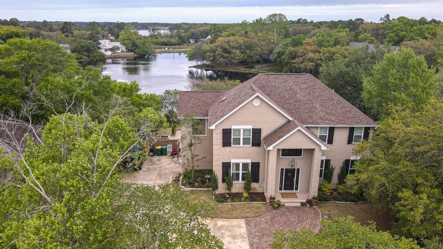 Welcome to this stunning and very private lake front home in the gated community at Eagles Ridge in Parkwood Estates. This home has 4 bedrooms, a large office, 5 bathrooms(3 full and 2 half) with 2 master suites. Chef's kitchen has custom cabinets, granite counter tops and a large walk-in pantry. Kitchen opens into a fabulous great room with soaring ceilings, a gas fireplace and fantastic views of the lake, pool and gorgeous yard. Step out of the great room to a huge deck overlooking salt water pool and spa surrounded by a paver patio. Lovely manicured lawn going out to the lake. On the lowest level is walk out basement that leads to pool and fabulous back yard. The first floor master suite has a large soaking tub, separate shower and a vanity with Carrara marble and a large walk-in closet