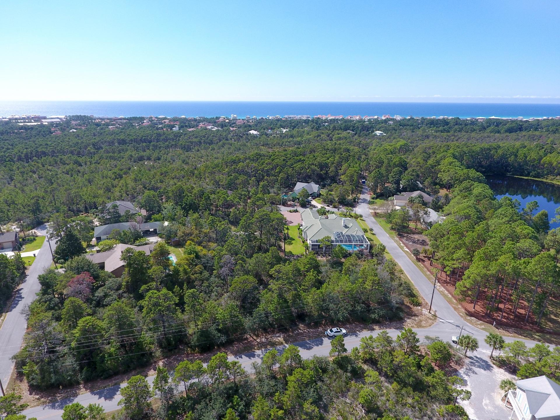 Large beautiful .34 ac corner lot with 100' & 150' frontages, perfect for driveway on both streets! no HOA (see covenants and restrictions for more info). The average home presently being around 2,000 sq ft, in this quiet upscale area, within walking distance of the Gulf. Santa Rosa Ridge is one of the last neighborhoods left along 30A with no HOA. Buyer to verify any filed covenants and restrictions. Santa Rosa Ridge is less than half a mile to the beach at Ed Walline Park, minutes to shopping and dining at Gulf Place and along 30A, and from Hwy 98, the post office, grocery stores and other local merchants. Drive your golf cart to all the wonders of 30A - you'll be amazed if you haven't experienced it! Don't miss this opportunity for a great price with building flexibility.