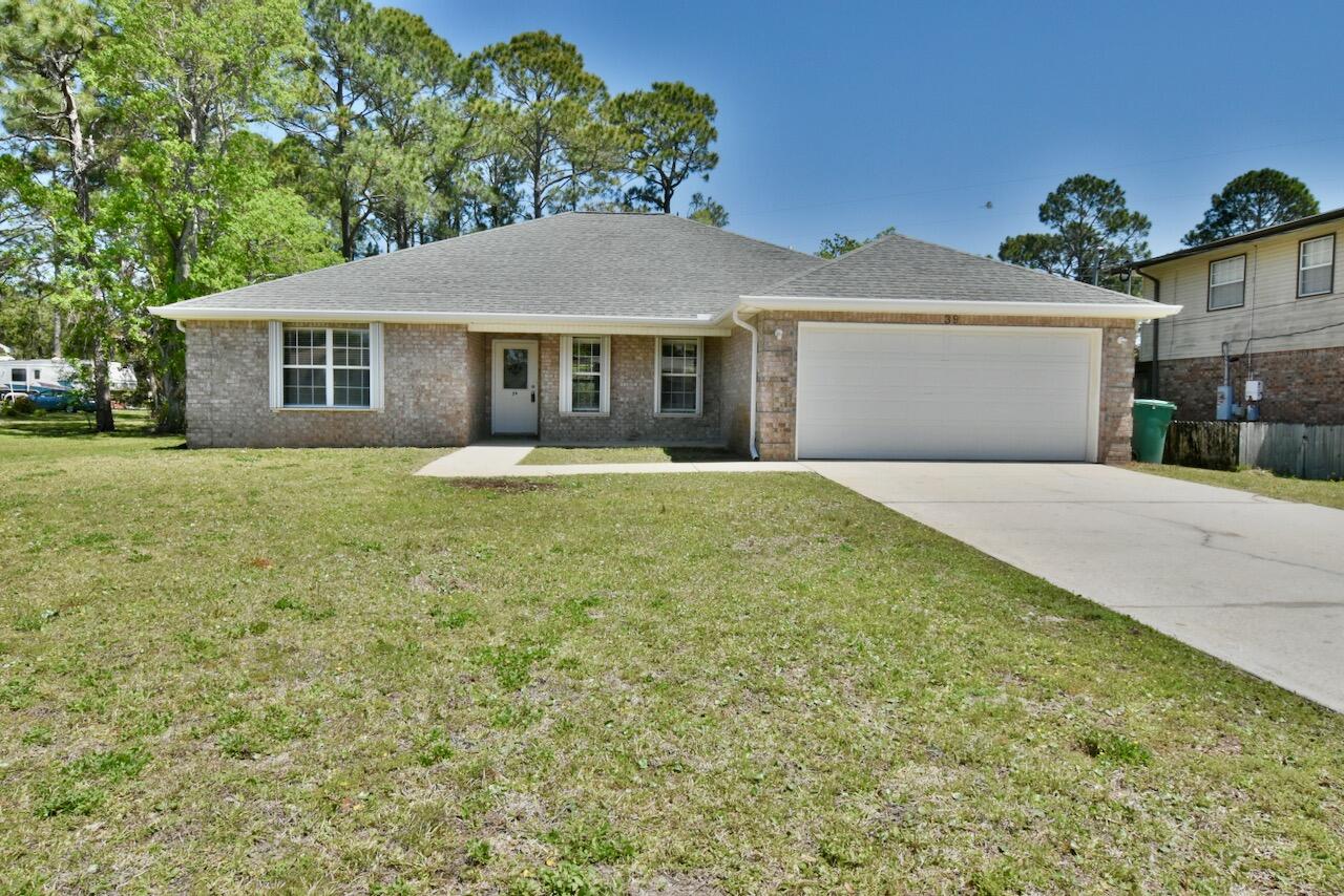 Beautiful home in Casa Loma Subdivision. Minutes to Hurlburt Field. This large 3 bedroom/2 bath features a large primary bedroom with en-suite bath double vanities, whirlpool tub, & separate shower. The tiled living areas are open to dining area. Carpeted bedrooms, a large covered porch, beautiful kitchen with stainless steel appliances & corian countertops.