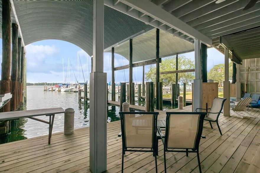 The most unique property in Fort Walton Beach & most desirable location! This boathouse is built out over the bayou & features a 44' x 18' boat slip! Located at the north end of Ferry Road & adjacent to Fort Walton Yacht Club, this is the perfect location for coastal boating fun!  This unit has been in the sellers' family for many years & have never been rented.  Casual & comfortable living areas--furnishings to remain. Large deck area downstairs fronting the slip & large upper deck overlooking the sparkling waters of Cinco Bayou! Access Choctawhatchee Bay & Crab Island in minutes! The Gulf of Mexico accessible via East Pass/Destin.  Street-side parking. Adjacent to the Fort Walton Yacht Club-a private social & sailing club that has been a favorite of members for years! Rental potential!