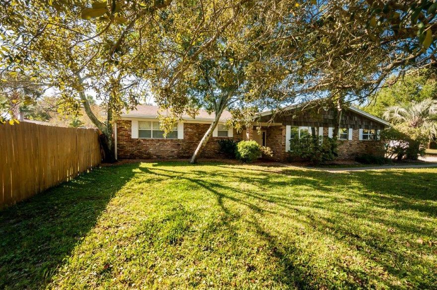 Location, location, location! Double lot! Large brick home on over 1/2 an acre corner lot in the heart of Destin. Great floor plan with 4 large bedrooms and 3 full baths, oversized living area with fireplace and built ins, separate formal dining or media space and split floor plan - 4th bedroom suite on opposite side of house would be perfect for mother in law quarters. Easy care tile throughout. Fresh paint and new fixtures. French doors lead out to large fully fenced backyard with 30,000 gallon gunite pool and new sand filter. Multiple gates offer access to plenty of storage space for boat and/or RV. No HOA! Two car garage plus circular driveway provides