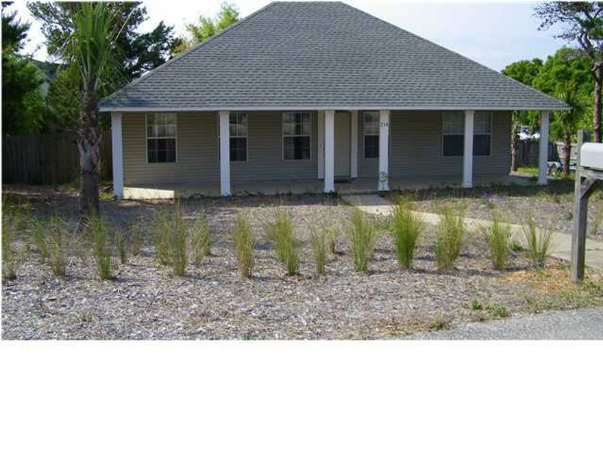 Amazing cottage beach house with wrap around front porch in the heart of Destin!!! This lovely home is on a large, corner beach type lot - very little maintenance!! Spend your time enjoying Destin and the gorgeous beaches instead of working on the yard. Beach colors throughout home; carpet on stairs only, spacious master bedroom and one additional bedroom located on first floor; hall bath features a nostalgic, free standing, footed and cast iron tub with shower!!!! Living room has gas fireplace with a beautiful antique solid oak mantel and tile floors. Third additional bedroom located at top of stairs. Relaxing, large deck off back of home which is perfect for entertaining, outdoor BBQs and relaxation. Two car garage with plenty of storage and parking. Cat and/or dogs up to 60lbs