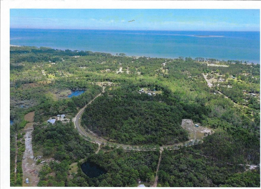 Great 1 acre property for home or vacation house or fish camp, set 1 mile appx from the Gulf of Mexico.  No HOA!!  Property lies 2 miles from Carrabelle Beach.  Land has been deforested, only a small portion in the rear of the lot has minor forestation.  Cleared land has grass planted.  There are both water and sewer hookups already on the property, tap fees have been paid.  Duke Energy  has a pole near the property and a fire plug is within 50 feet of the property.  The land is flood zone X.  Also, this is a Cull-de-sac Road, so it is a peaceful area.  All measurements are estimates.