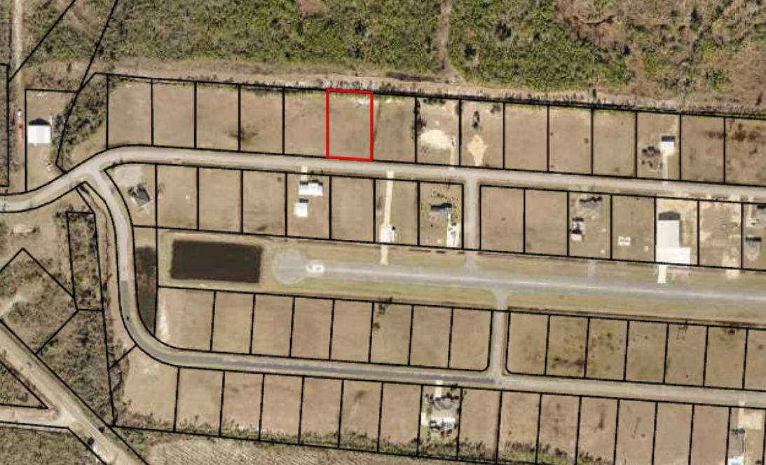 3/4+/- acre lot located in Sandy Creek Airpark. Sandy Creek Airpark is one of the most desirable fly-in communities in the southeast. This beautifully grassed lot is directly on the north side of Airway Street, cleared and ready to build. It is one of the few available lots that is NOT IN A FLOOD ZONE. The Airpark is a gated community and has a 3800 foot paved and lighted runway and uncontrolled airspace. It also has an EAA Chapter right on the field. Located on the eastern edge of the New Orleans Sectional chart, this airpark is perfectly located. If you are flying in the runway elevation is 13 ft and the unicom frequency is 122.9. If looking for a location to build a fly-in dream home, this is it.