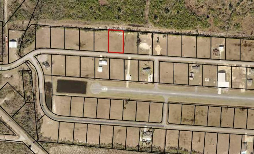 3/4+/- acre lot located in Sandy Creek Airpark. Sandy Creek Airpark is one of the most desirable fly-in communities in the southeast. This beautifully grassed lot is directly on the north side of Airway Street, cleared and ready to build. It is one of the few available lots that is NOT IN A FLOOD ZONE. The Airpark is a gated community and has a 3800 foot paved and lighted runway and uncontrolled airspace. It also has an EAA Chapter right on the field. Located on the eastern edge of the New Orleans Sectional chart, this airpark is perfectly located. If you are flying in the runway elevation is 13 ft and the unicom frequency is 122.9. If looking for a location to build a fly-in dream home, this is it.