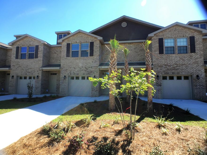 Beautiful brand new townhome at Reserve Pointe in Navarre, Florida. This 3BR/2.5BA townhome has a definite ''wow'' factor. From the moment you enter, you'll be amazed with the craftsmanship and decadent touches found throughout the space. This includes granite counter tops in the kitchen and bathrooms, stainless steel appliances, beautiful fixtures and flooring. Downstairs you will find the main living areas and a conveniently placed half bath. The bedrooms have been placed upstairs for additional privacy. The backyard area offers a nice patio area that is perfect for summer barbecues and cookouts.Reserve Pointe is one of Navarre's newest communities and comes with a range of amenities for residents. This includes a playground, community pool, picnic tables and deck space. Lawn care i