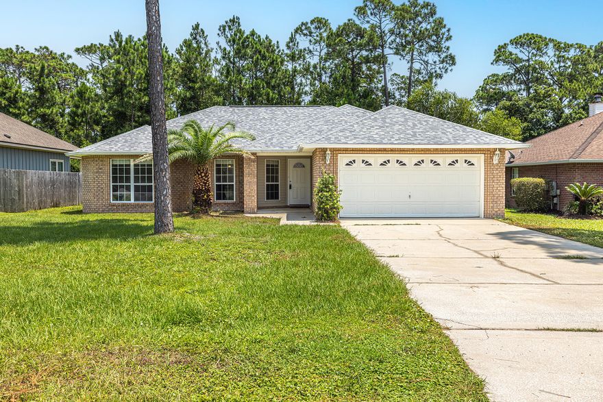 Spacious 4 bed / 2 bath located in beautiful Navarre!  Community has deeded WATER ACCESS just down the street. NEW ROOF INSTALLED IN 2022!
This property offers an open floor plan w/ a large living room highlighted by cathedral ceilings, and a cozy fireplace. FRESH PAINT THROUGHOUT, BRAND NEW CARPET, and LIGHT FIXTURES!
Eat-in kitchen with white shaker style cabinetry, BRAND NEW STAINLESS STEEL APPLIANCE PACKAGE, and breakfast bar. Primary bedroom with walk-in closet; En-suite bathroom featuring double vanity with cultured marble countertops, relaxing garden tub, and separate shower. Desirable split-bedroom floor plan with 3 additional bedrooms, and a full bath separate from the primary suite.
This home comes complete with a large backyard, sprinkler system, and an attached 2-car garage