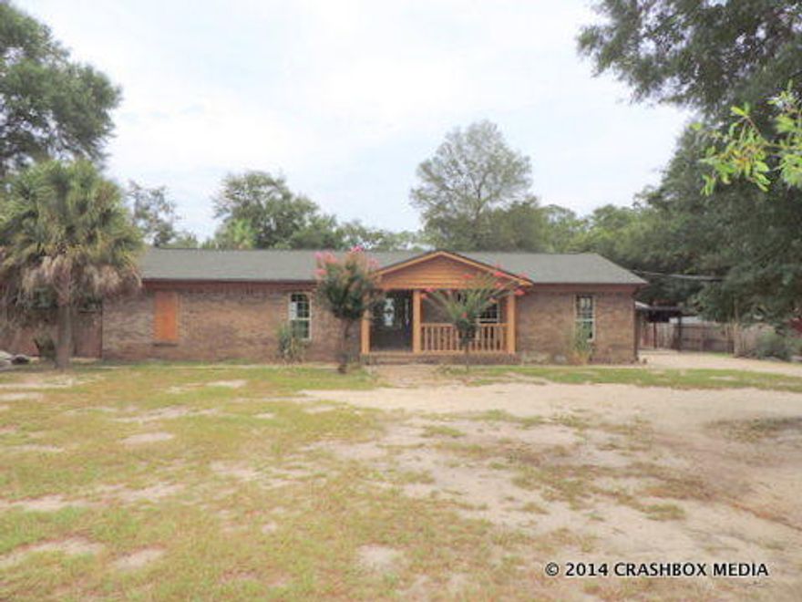 NAVARRE SMALL FARM - ALL BRICK HOUSE LOCATED ON 1.83 ACRES ON CREEK, 300'CLEARED AND FENCED & 93' WOODED TO CREEK. TOTALLY FENCED YARD BEHIND THE HOUSE AND ON THE ACREAGE LOT ADJOINING HOMESITE. 3 BD/2 BATH OPEN FLOOR PLAN, LIVING ROOM & DINING ROOM AREA COMBINED, LAUNDRY ROOM OFF KITCHEN. KITCHEN HAS BREAKFAST AND MANY UPGRADES. THE PROPERTY BOASTS A STORAGE HOUSE WITH OUTDOOR KITCHEN AND BATHROOM AND A GARAGE WITH ENTRY AT BOTH ENDS AND ANOTHER STORAGE ROOM. THE HOME DOES NEED REPAIR BUT THE PROPERTY HAS BEEN UPGRADED TO A CRAFTSMAN STYLE. ENJOY THE INGROUND POOL, ANIMAL PENS, GARDEN AREA, AND MORE. SOLD AS IS. ALL INFORMATION IS APPROXIMATE AND SHOULD BE VERIFIED. BUYER TO VERIFY ZONING AND PROPERTY USE.