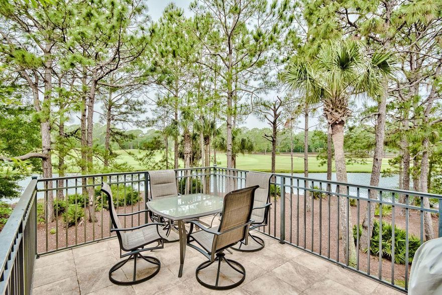 Amazing lake and golf course views wrap around this generous three bedroom with three and a half baths home that conveys fully furnished with a large middele one and a half car GARAGE and GOLF CART included! Walk into the foyer and see the dramatic wall of  windows and 20 foot ceilings in the living area. The kitchen with breakfast bar provide sliding glass door access to the tiled balcony perfect for soaking in the views and for grilling with your friends. The dining area is circular with windows  all the way around. The kitchen. dining and living area offer large neutral ceramic tiles perfect for easy maintenance.  Located on the main level. the master suite offers a  large walk-in closet and an en suite bath featuring a double vanity, garden tub and separate shower.