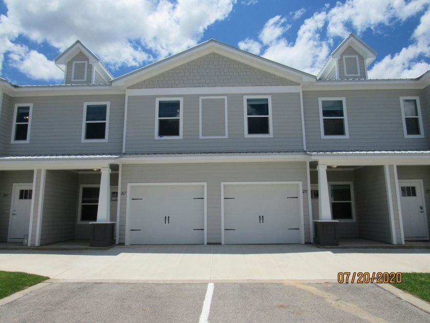 Immaculate, 2020 built, 3 bedroom, 2.5 bath town home with every available upgrade, a GARAGE, and a community pool! This lovely home is across the street from an elementary school, just down the road from a Publix shopping center, and a short, easy commute to the sugar sand beaches and emerald waters of 30a/SOWAL. It has fresh, neutral paint and no carpet throughout. The open floor plan on the first level includes a nice size living room with nook, eat-in kitchen with breakfast bar, quartz counter tops, plenty of counter/cabinet space, stainless appliances (including a flat cook top stove), beautiful backs splash, and pantry as well as a half guest bath with pedestal sink and a screened-in back porch overlooking a green area. Upstairs, you will find the master bedroom, complete with a walk-in closet, as well as a luxurious en suite with double vanity, quartz counter tops, and stand-up shower as well as two guest rooms (one with a walk-in closet) sharing a full guest bath and the laundry hookups. There are plenty of closets and also attic for storage. Pool care, lawn care, and garbage included in the rent. Pets may be considered on a case-by-case basis with prior owner approval and a non-refundable pet fee. No smoking including vapes.