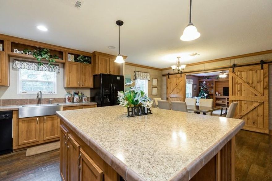 Beautiful 5 Bedroom 3 full Bathrooms home located in a very quiet area. This home features 2 living room one with a built in entertainment center. The kitchen is fully equipped with all appliances and a kitchen island that has a breakfast bar and built in shelves. All 5 bedrooms have large walk in closets. This home is less than 2 years old and has been very well maintained. Owner suite features a deep Garden tub and standing shower with double vanity. This home also features an oversized laundry room. You definitely do not want to miss this opportunity. This home is located on 2.32 Acre Lot. With the lot wooded enough to put up a deer stand if desired. Schedule your showing today. Easy access to interstate 10. 25 min commute to Duke Field and 7th SFGBuyer to verify all measurement