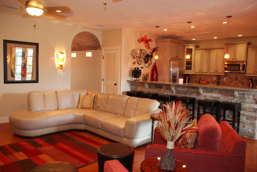 This very rare condo in the Heart of Baytowne Village is a must see to appreciate all the unique details. Great balcony that overlooks the Village where you can listen to Live Music in the Park along with front row sets to the fireworks that Baytowne is known for, sits directly over some great places to eat and shop. This is modern style 3 Bedroom 2 Bath loft that is a turn key ready property with great rental history 60K in 2014. When entering this condo you notice the arched foyer hallway covered in red brick, true New Orleans Style that opens up to a large breakfast bar, spacious kitchen with stainless appliances and tile backsplash. The master bath features a clawed tub with a full walk in glass shower and double vanity...This property is fully furnished