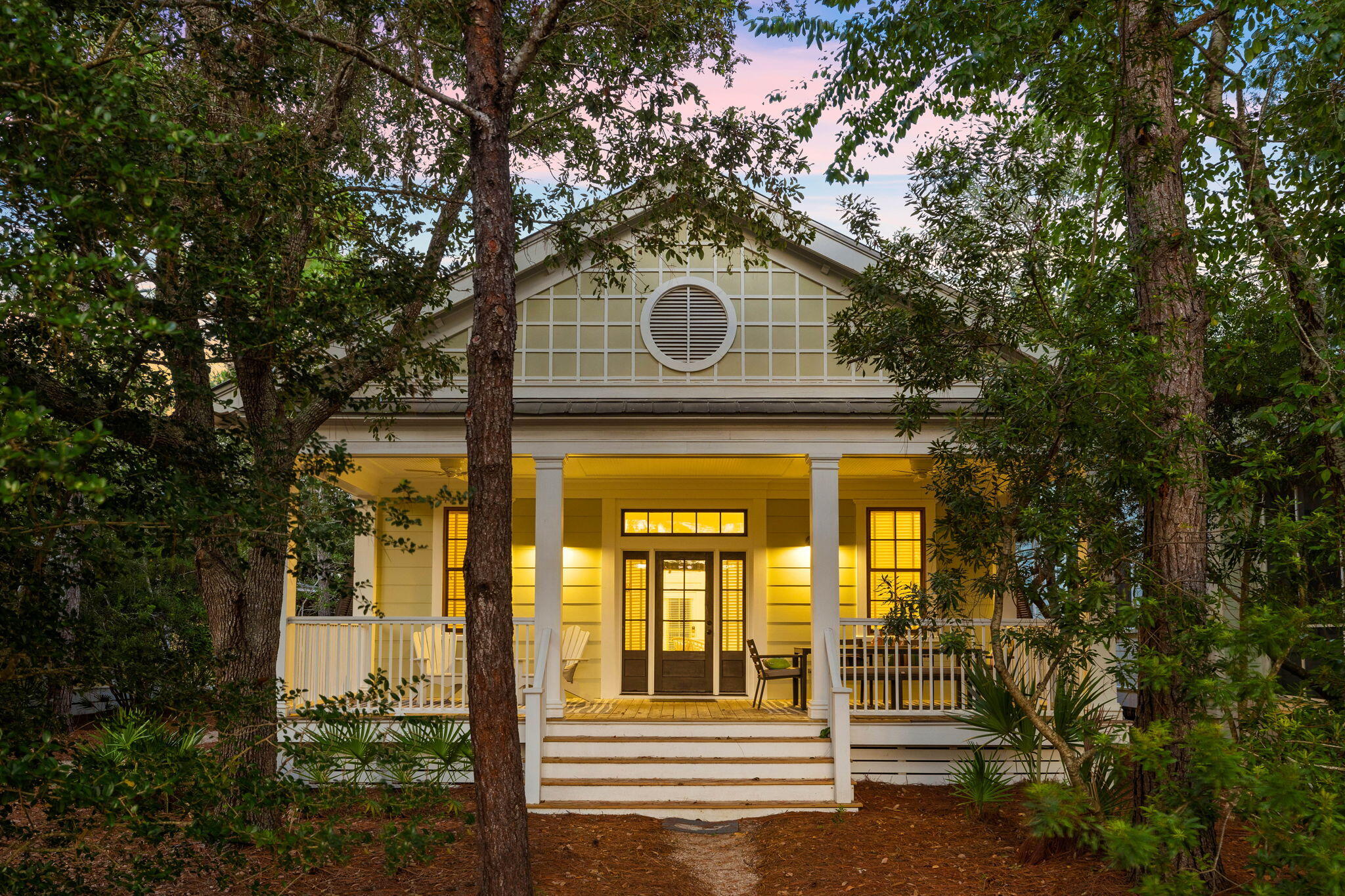 Under contract with a Kickout Clause. Nestled within the renowned Watercolor Phase I, this captivating Florida cottage is embraced by serene wooded surroundings and offers the potential for seamlessly expanding its living space to accommodate additional square footage, should you wish to do so. Professionally decorated, this cozy beach home exudes understated elegance with light airy rooms and a full-width screened porch for lazing away the days in this shady spot. From the paved parking area, a covered arbor leads to the door. Recent upgrades to the home include a new A/C unit, water heater, recessed lighting and insulation in the crawl space. Inside, hardwood flooring transitions to practical tile in the bathrooms.