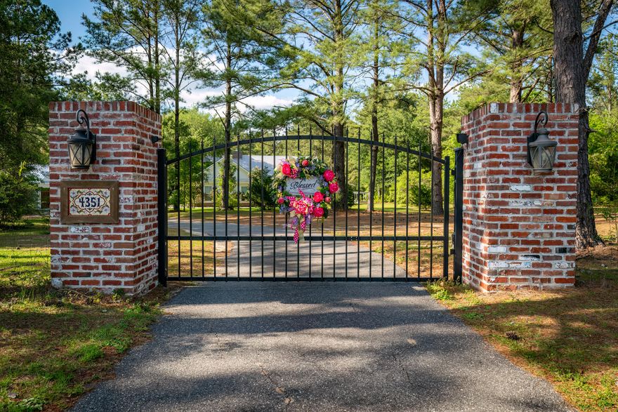 SELLER OFFERING $15,000 IN BUYER INCENTIVES-YOUR CHOICE, CLOSING COSTS, UPGRADES, OR PERMANENT RATE BUY-DOWN (POTENTIALLY INTO THE LOW 5'S WITH PREFERRED LENDER). Welcome to a home that's truly one-of-a-kind--where exceptional features and thoughtful details transform everyday living into something extraordinary. This isn't just a house, it's the perfect backdrop for life's special moments, from lively birthday parties to cherished family reunions. A stately entrance with brick columns and an elegant iron gate offers privacy and timeless curb appeal, inviting you into a world of warmth and style. Host unforgettable nights under the stars in your private outdoor oasis, complete with a cozy fire bowl and grillwhere warmth, charm, and memories come alive. Relax in the primary suite with a custom closet, built-ins, and a walk-in retreat with desk. Bonus spaces include a pool house, a 'she shed,' and a flexible outbuilding for games, movies, or hobbies. A home designed for comfort, style, and lasting memories.