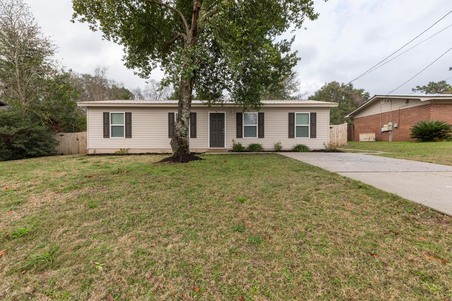 A MUST SEE! This adorable, Move In Ready, 3 bedroom home on a large lot in Crestview will steal your hearts! The perfect home for starting out, downsizing, or investing! You can't go wrong here. This home was completely re-built right down to the studs, approximately 5 years ago. Complete with metal roof, fully privacy fenced, LARGE back yard, and shed that is wired for electric, and can be hooked up, if you so desire. You will love the eat in kitchen, Laundry room with plenty of space for added cabinets or shelving, and the master bedroom with it's low maintenance vinyl, wood look flooring. Call your Lender, grab your agent, and come tour this delightful home today. What a GREAT way to start out your New Year! Welcome Home!