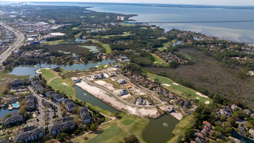 Less than a mile from the beach! Build your dream home in one of Destin's most desirable golf communities! The homesite (lot 52) is located in Regatta Bay's newest development, TradeWinds. TradeWinds will consist of 54 homesites. Homes will be of a West Indies w/ Dutch influence style of architecture. Owner has the option to use an approved Architect & an approved Builder. Regatta Bay is a quiet, gated, golf & boating community that offers a LIFESTYLE unlike no other! The Regatta Bay Lifestyle is about convenience! You can golf cart to so many fun places in minutes, including the Beach! (See aerial photos) Within Regatta Bay, there is golf, swimming, tennis, pickle ball, park, playground, Regatta Bay Clubhouse, Legendary Marine & Legendary Yacht Club. Click 'more' to continue. Regatta Bay offers a private road that takes residents to the Destin Commons, where you'll find an array of popular men's and women's retail stores, a variety of restaurants, Whole Foods, Bass Pro, Lowes, AMC movie theater and Uncle Buck's Bowling! ALL ACCESSIBLE BY GOLF CART.