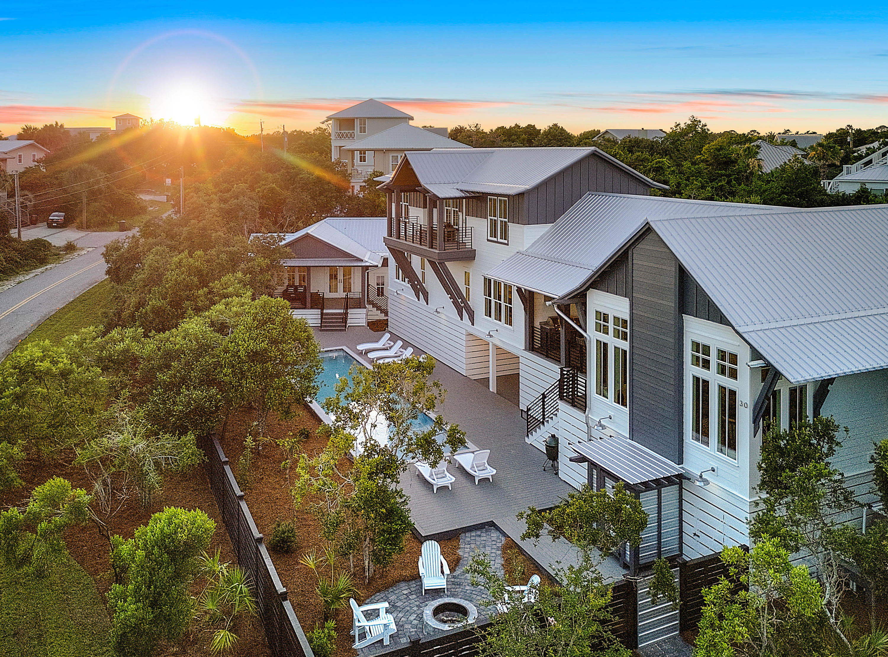 Urban design and collaboration of a team of three presents to you a beach house like no other! This West Side Story of 30A begins at 5,093 sqft with gulf views from many angles! The incredible Architectural Structure by Tyler Doin gives you a 5 bedroom/5 1/2 bath home with exterior features that makes this design stand out along 30A. No corner, trim, wall, or any other building detail has been left untouched by Limbach Developments during the building process that began in June of 2017. This home flows from one room to the next with details such as antique chestnut cabinets, copper niche and sinks, cantilevered streamlined bunk beds, waterfall silestone counters, and modern industrial concrete lighting. The outdoor space leaves you coming home to a 12x50 foot pool with a sun shelf,