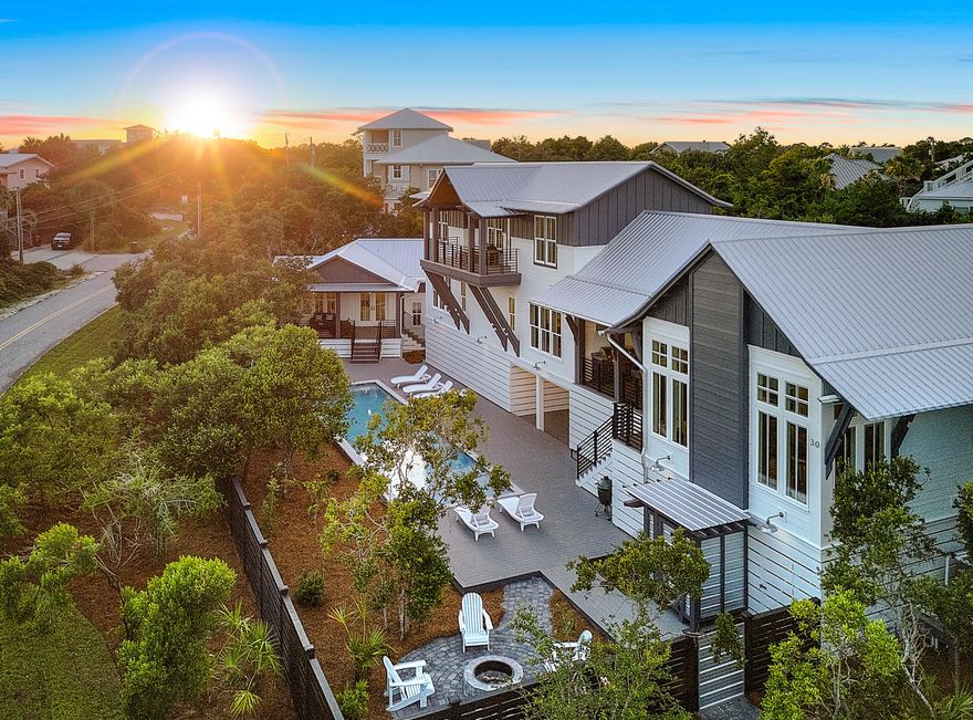 Urban design and collaboration of a team of three presents to you a beach house like no other! This West Side Story of 30A begins at 5,093 sqft with gulf views from many angles! The incredible Architectural Structure by Tyler Doin gives you a 5 bedroom/5 1/2 bath home with exterior features that makes this design stand out along 30A. No corner, trim, wall, or any other building detail has been left untouched by Limbach Developments during the building process that began in June of 2017. This home flows from one room to the next with details such as antique chestnut cabinets, copper niche and sinks, cantilevered streamlined bunk beds, waterfall silestone counters, and modern industrial concrete lighting. The outdoor space leaves you coming home to a 12x50 foot pool with a sun shelf,