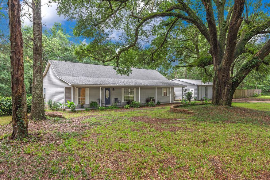 BACK ON THE MARKET.  NO FAULT OF THE SELLER.This 2 acre country setting home is ready fo you to move in.  It is a 3 bedroom 2 bath with a detached 2.5 car garage!  Plenty of room for you to tinker in!  The master suite is oversized and has it's own office/sitting area for you to enjoy your serene surroundings.  You can walk out to your back deck and enjoy your morning coffee from your master suite.  If you enjoy rainy afternoons, this home has the perfect front porch for you to sit and relax.  The living room is spacious  with vaulted ceilings.  2nd smaller yard barn and water filter contraption on the other side of large garage are considered as is where is and no warranty.