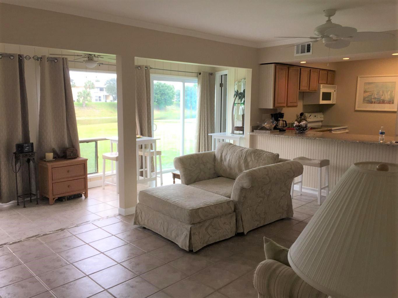 Rare Find 1 Bedroom 2 Baths, very spacious condo. Pretty view of the Lake. Close to the pool & club house. Easy access. First floor walk out. Patio area closed in. Breakfast bar, tiled floors, granite counters, new appliances. many updates to this condo. Great rental for short or long term. Close to Beaches, Restaurants, Shopping & Entertainment. Amenities include: 3 Pools, Tennis, Out Door Grills, Community Room. Buyer to verify any & all dimensions.