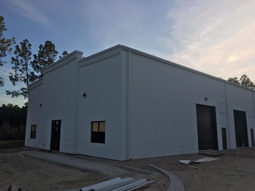 Brand New Beach Group Industrial Plaza in South Walton Commerce Park. Completion December 2019 . 24' Ceiling height, roll up doors, bathroom, adjacent to new school and Sports Complex. Also 3000 sq ft space available with store frontage and roll up door. Can combine spaces for additional sq footage. Power Doors, bathroom with water fountain, Heated and cooled!
