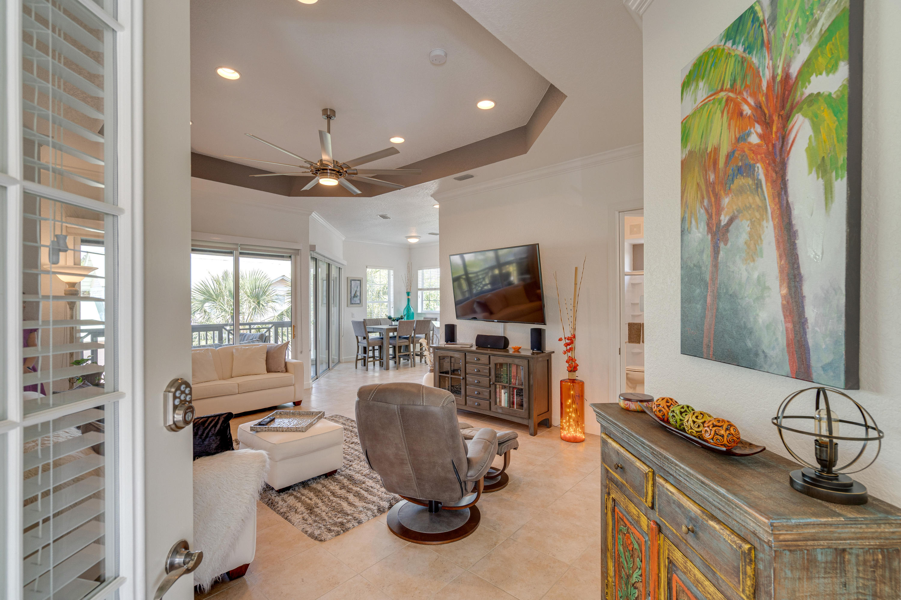 Beautifully professionally updated, 2nd floor condo in Crystal Cove, located in the Crystal Lake communities. Enjoy an evening on the large balcony featuring a retractable screen and views of the lagoon. Enter the balcony from the living room or dining room through the use of two large sliding glass doors that stack to one side. The open kitchen and dining room area has all new cabinetry, granite counter-tops, appliances and also boasts views of serene Crystal Lake. The master bedroom has french doors to the balcony, a walk-in closet with ample storage including finished storage space in the attic. The en-suite bathroom has new matching cabinetry with double bowl granite counter-tops and new mirror accents. 10ft ceilings and 8ft doors enhance the size of the living space in this home.