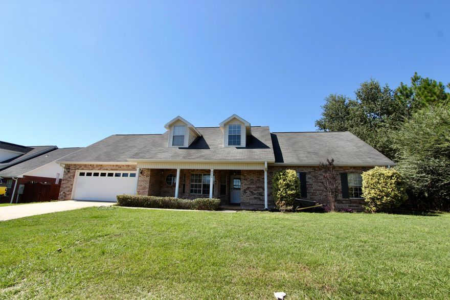 This beautiful and spacious 4-bedroom, 3-bath brick two-story home sits gracefully on a generous one-third-acre lot. You'll love the kitchen, featuring abundant counter space, a breakfast bar, and a large eating area--perfect for gatherings and everyday meals. The expansive living area offers vaulted ceilings that create an open, airy feel, and the formal dining room provides an elegant space for entertaining. Step out to the screened porch and enjoy views of the huge, privacy-fenced backyard, ideal for relaxing or hosting outdoor activities. A $2,500 flooring allowance is included, giving you the opportunity to personalize this inviting home to your taste. Schedule your tour today!