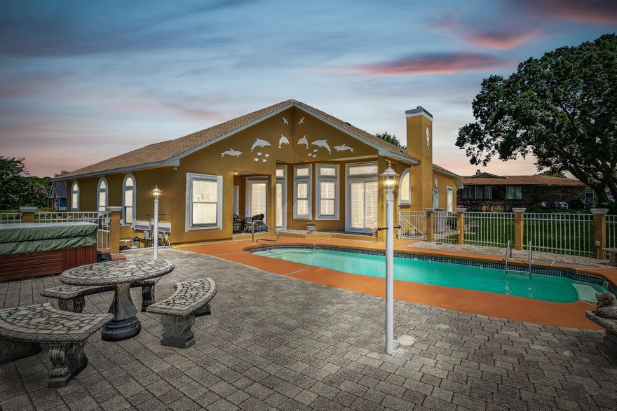 This custom built home with a pool, hot tub and Sound view will not disappoint. Upon entering this exquisite home you will find plenty of natural light, 2 living areas, a dining area and gorgeous kitchen overlooking the family room and breakfast nook. The views from the large master over look the pool and sound are simply spectacular. The primary suite also offers a sitting area and 2 closets with plenty of space. There is access to the guest bathroom from the pool and hot tub area. Located approx only 7 mins to one of the finest beaches on the Gulf Coast. This peaceful neighborhood without an HOA is a sought after gem in Navarre. (SOUND ACCESS FOR THE NEIGHBORHOOD to fish, launch a kayak or swim) Updates: Roof, HVAC, Windows, Water Heater, Master Bed/Bath painted, Master flooring.