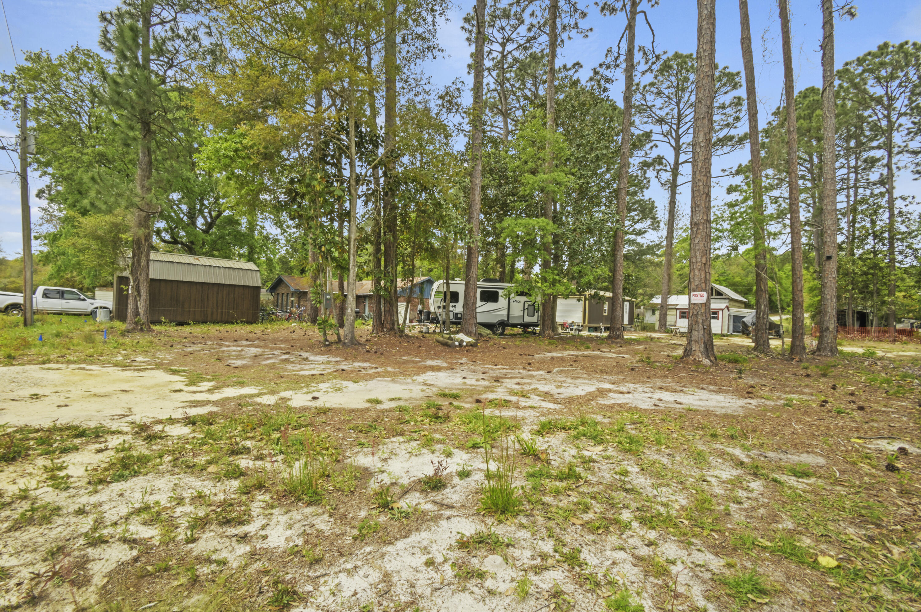 Flat lot with ALL UTILITIES in place-MUST SEE! Perfect for building your custom, dream home in the picturesque Choctaw Beach community. Shed conveys with property. Seller will move tiny home and trailer, leaving an empty canvas for the future owners. Close to Niceville (5 min), Destin (10 min), Eglin (20 min), 30A (25 min), and Hurlburt (30 min)! Walk 10 minutes SW to the community WATERFRONT park - great for picnics with a sunset view. Walk 10 minutes SE to the community center with a playground, basketball court, and frequent events! The public boat ramp & park is only a 3 minute drive away with a boat launch, playground, splash pad, picnic tables, and a boardwalk. Choctaw Beach even has a little-known sandy beach 3 minutes away! Bring your house plans and make this your new home!
