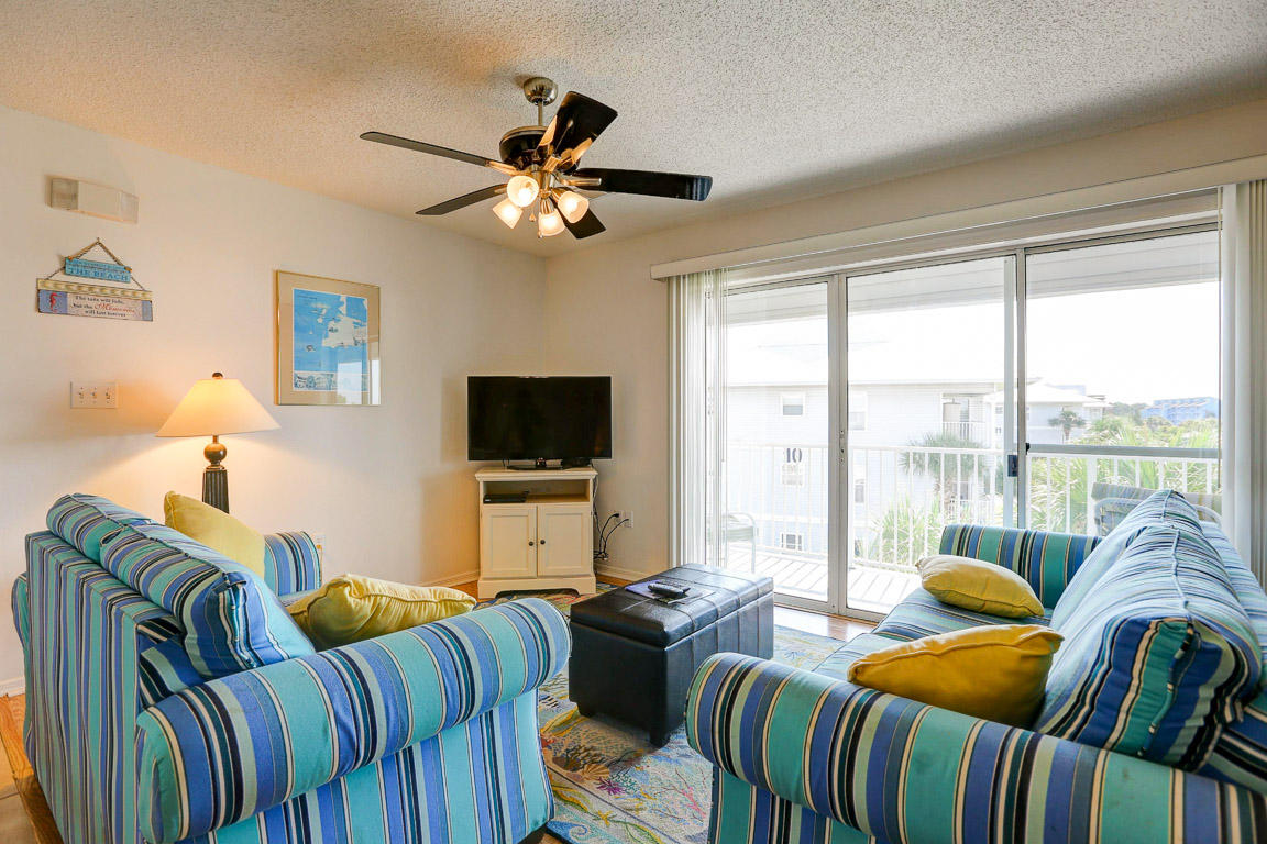 You'll love the easy living at Beachside Villas located south of 30A near the sugar white beaches of the Gulf of Mexico! One of the largest floor plans in Beachside Villas this 3 BR 2 1/2 BA condo is located near the main pool, tennis courts and beach walkover! A great rental and great get-away! Beachside Villas consists of two pools (one heated), two tennis courts, shuffleboard courts, grills and community room. This roomy 3rd floor condo offers master bedroom with ensuite bath, 2 additional bedrooms with bath and half including 2 vanities, 2 toilets and tub/shower combo. The kitchen with breakfast bar opens to the living/dining area. A covered balcony with roomy outside storage is accessed from both the living room and master bedroom. The unit is offered fully furnished including
