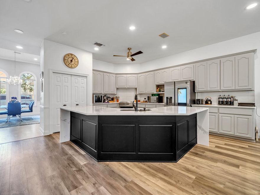 Discover the potential of this inviting home, perfectly situated on a desirable corner lot in Indian Bayou. From the moment you arrive, you'll be welcomed by a striking circular paver driveway that sets the tone for this unique property.Inside, the split and open floor plan offers a seamless blend of comfort and functionality, with three spacious bedrooms, three full bathrooms, and a dedicated office space. The heart of the home--comprising the kitchen, dining area, living room, and office--has been completely renovated, boasting modern finishes and thoughtful design.Step outside to an expansive 38x12 screened-in back porch, perfect for enjoying your morning coffee or unwinding with an evening glass of wine. The oversized garage provides ample space for storage or projects, and while the property doesn't currently have a pool, there's plenty of room to add one. Easement access has already been granted, and pool layout ideas are available in the photos.

This home offers endless possibilities to create your dream outdoor retreat and is ideal for entertaining or simply enjoying life's quiet moments. Don't miss this opportunity to make it your own!