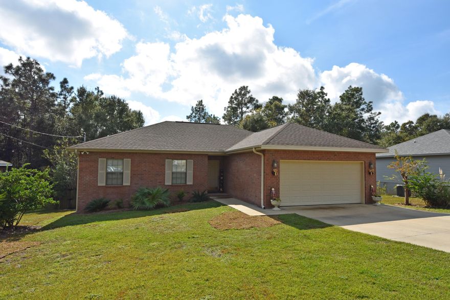 ALL BRICK home with 9 ft. ceilings, Corian countertops, cultured marble vanities, 3 Bedrooms and an Office! The 20 x 10 COVERED back deck is great to enjoy your Wooded View and Privacy Fenced back yard complete with a 16x10 Work Shed and 6' covered porch on the front, an open patio to enjoy your evenings with a wood burning fire. Master bedroom accented with a tray ceiling and bath features: walk-in closet, linen closet, soaker tub and double vanity. Flooring consists of tile in foyer, kitchen, dining area, utility and baths and carpet in all other rooms. Extra cabinets in the laundry, 2nd Bathroom, and Garage for Storage. Extra Wide driveway can easily fit two cars side by side. Schedule your private viewing today! 1 YR Home Warranty provided at a value of $400. Buyer to verify info.