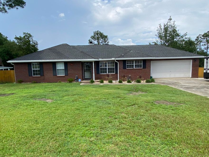 Lovely all brick ranch on large lot with tile and new laminate flooring thru out. There is a 2 car garage with an extra concrete pad with 30 Amp camper hook up. Back yard has a multi level deck for entertaining and storage shed for lawn equipment. The home has a laundry room with a large pantry. The kitchen has plenty of storage with under cabinet lighting and a breakfast bar. You will find His and Her closets in the master bedroom with a nice size master bath. This home is move in ready.