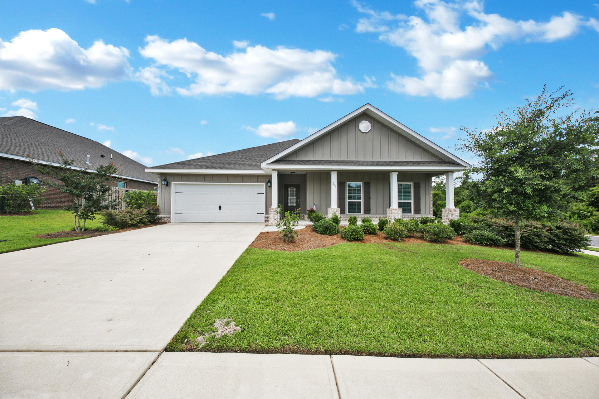 LIKE NEW home in Hammock Bay! You'll enjoy the upgraded white cabinets, crown molding, tray ceilings, granite, and stainless steel appliances. Plus, the back yard is already fenced for privacy from your back porch.  The adorable front porch beckons you to relax and unwind. With sidewalks and walking trails and close proximity to the amenities of Hammock Bay and the Central Park BBQ pavilion, you really will want to make this your next home. Please note: The sellers need to lease back after closing until their next home is complete. Expected date of completion is October/November 2021.