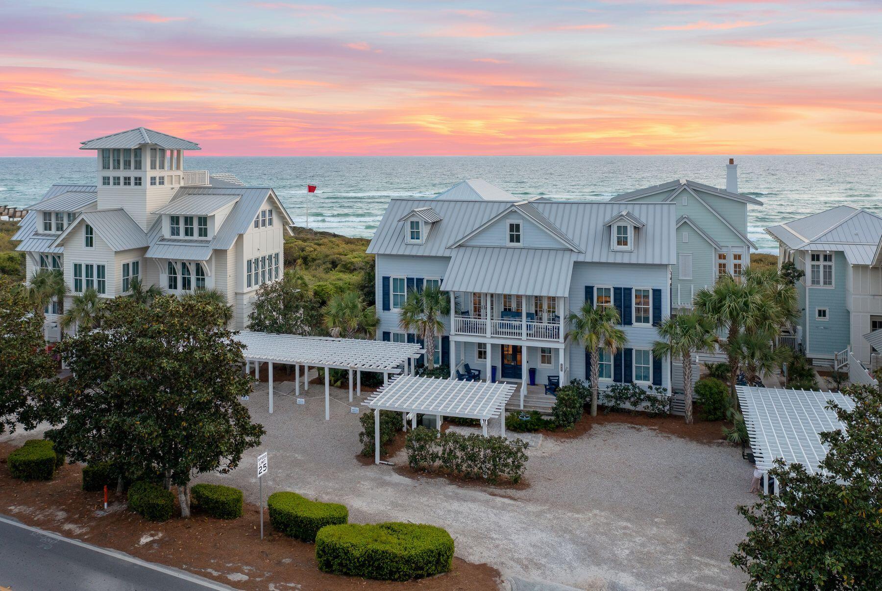 Situated in the heart of WaterColor's Gulf District, this stunning beachside home underwent a complete transformation in 2018, offering a blend of coastal elegance and modern comfort. Boasting panoramic gulf views, this three-story retreat is ideal for those seeking the ultimate beachside escape. Step inside to discover a professionally decorated interior, where every detail exudes sophistication. The first floor welcomes you with a spacious living area, perfect for family gatherings and game nights. A converted screened porch now serves as a convenient sand and laundry room, complete with double-stacked washer and dryer units and an ice maker. The home features five bedrooms, including two master suites, and can accommodate up to 12 guests.