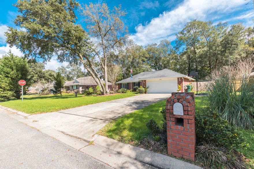 Beautiful home in Hawk's Nest subdivision boasting a split floor plan, high ceilings, upgrades throughout, and gorgeous landscaping. This home has new flooring, AC, and has a remodeled mother-in-law suite. The master bedroom is spacious with a garden tub in the bathroom as well as a separate shower, large walk-in closet, and double vanities. Enjoy a bright chef's kitchen with tons of storage, breakfast bar, and cozy tiled fireplace in the great room. Perfect home for family and entertaining guests! Luscious landscaping, fenced private backyard, pergola, and patio. Schedule your showing today!