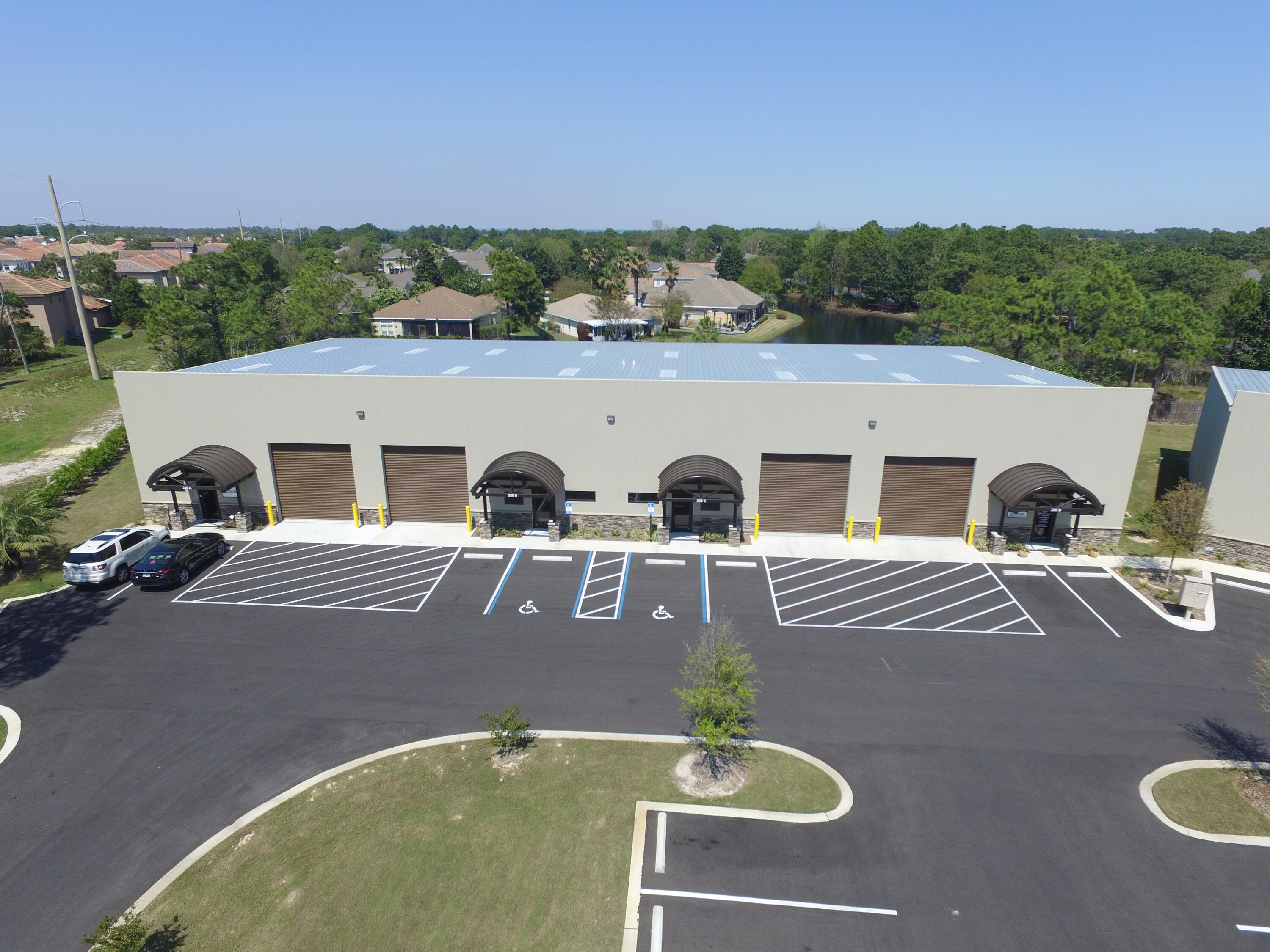 High quality Light Industrial space located in East Destin just off of Highway 98. Starfish Business Park is a newer Light industrial park consisting of 5 units. The location gives access to a controlled traffic signal along Highway 98. This is located just outside of Emerald Lakes subdivision. 3,000 SF consisting of 2300 SF open warehouse space and 700 SF office including a small reception area, 2 small offices, 1 large office and a single restroom. Adequate parking for each tenant is available in this business park. Rate structure is as follows: $16/SF base rent + $2.50/SF NNN fees + 5.5% sales tax = $4,879.38 per month. Landlord is looking for a long term lease, 5 years preferred.