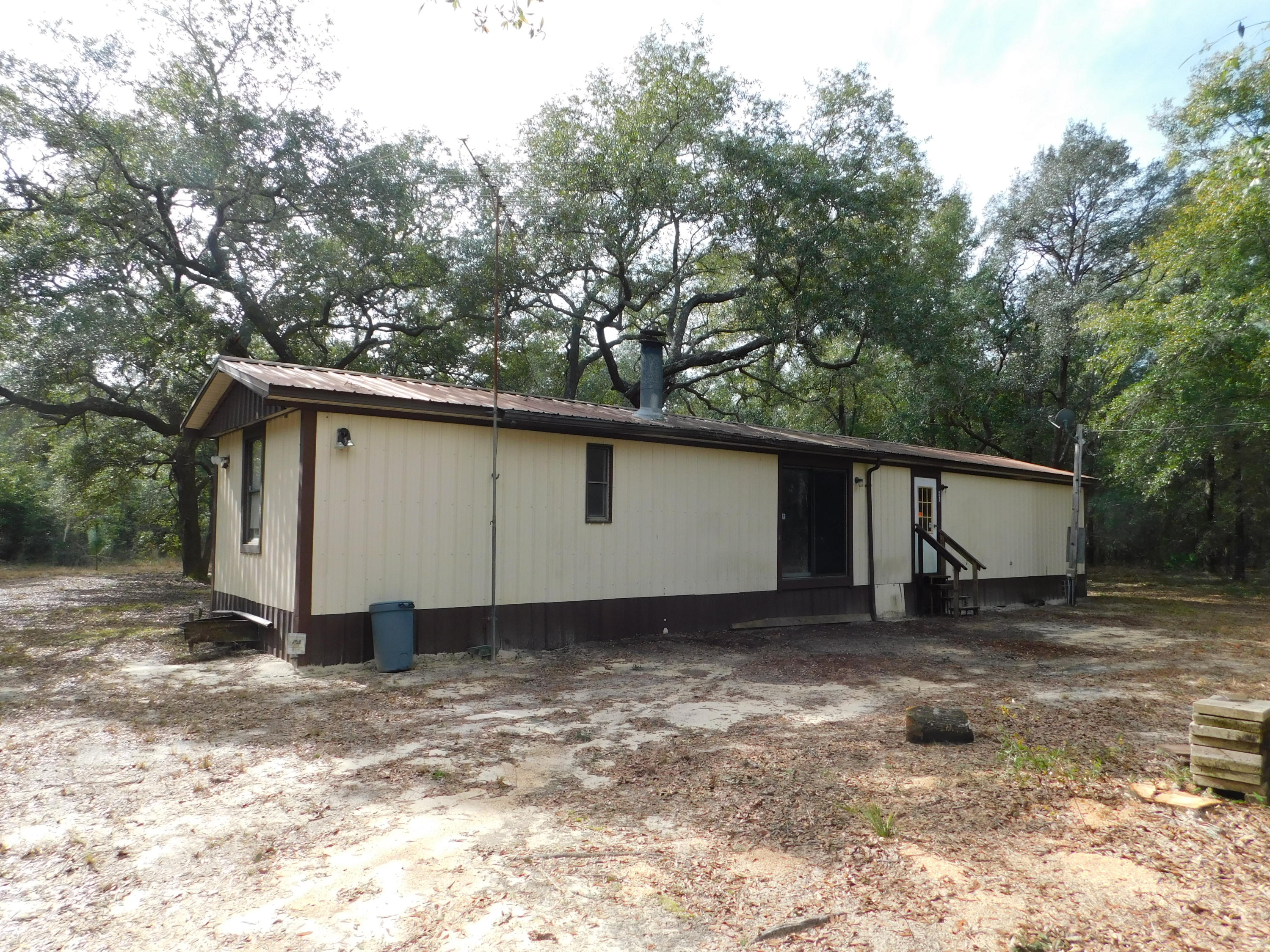 7 Acres with mobile home in the country! Bring your horses, cows, pigs, and chickens! Bring your home plans and build your dream home in the country or use the property for hunting! Come listen to the birds chirp, watch the deer and turkey, or ride your 4 wheeler!