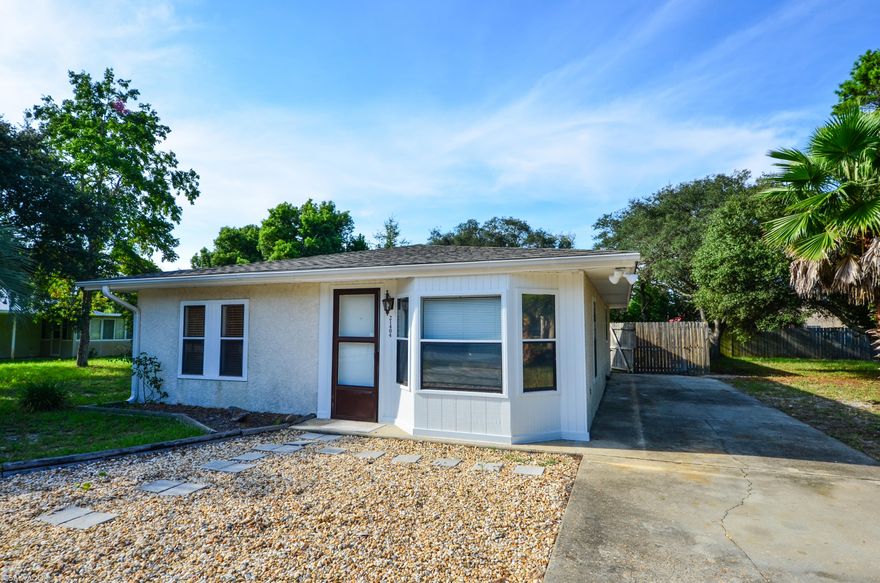 Great opportunity on the west-end of beach.This sweet 2 bedroom 2 bath home sits on a 75 X 110 lot. The home had a new roof put on 2013; new septic system and hvac system put in 2012. The land is beautiful on this parcel and the back yard is completely fenced. This