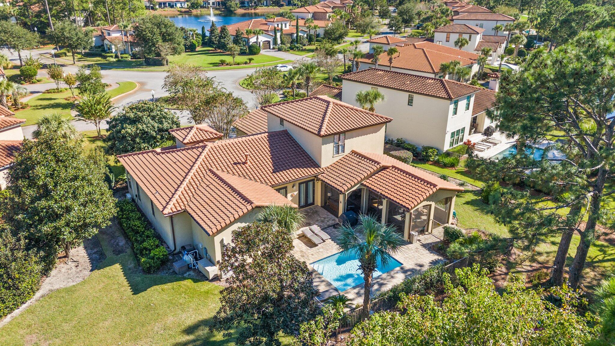 No detail was overlooked in this Tuscan style home on a quiet cul-de-sac lot with sweeping views of the 4th fairway of the Baytowne Golf Course. Where land is a premium, this stunning property features an expansive 146-foot lake front lot, with a private pool, in the sought-after Genoa neighborhood which is known for it's beautiful old-world charm. Enjoy an open concept living area featuring a large living room that merges beautifully with a high-end kitchen boasting Thermador appliances, large granite island, custom built-ins & a butler's pantry. This is your opportunity to live in one of the newest neighborhoods in the Sandestin Golf and Beach Resort, known for its pristine beach frontage, championship golf courses, pools, tennis courts,98-slip marina, shopping, dining & many festivals!