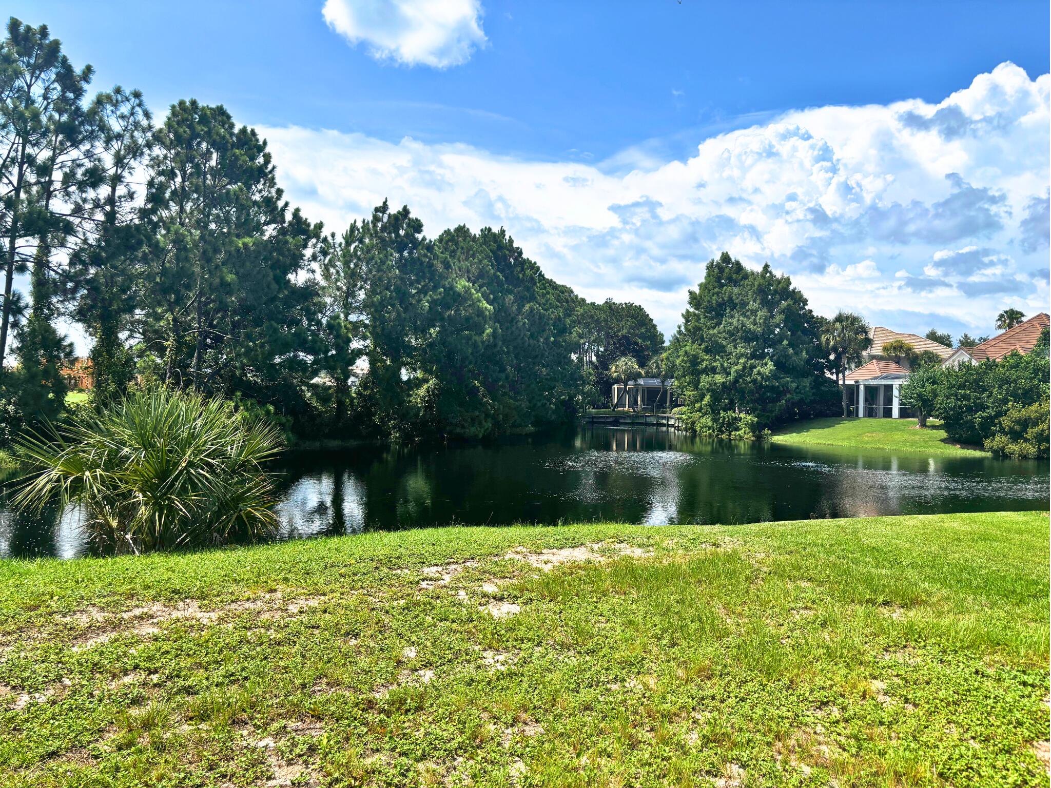 Prime lakefront lot in the heart of Destin. Welcome to Calusa Bay - a serene, gated community tucked away in the center of Destin. This cleared, lakefront lot offers the perfect opportunity to build your dream home with peaceful water views and lush natural surroundings. Your neighbor immediately to the west is Regatta Bay golf course and golf course views are achievable! Located on a quiet cul-de-sac, this homesite provides both privacy and tranquility while still being just minutes from everything Destin has to offer. Enjoy the security of gated access, a well-maintained community pool, and beautiful landscaped grounds. Calusa Bay is ideally located in close proximity to the sugar-white sands of the Gulf, championship golf courses, a variety of dining and shopping, and so much more.
The current owner has mostly completed house plans available and we also can get you connected with an established local architect and home builder who have designed and built several homes within the Calusa Bay community.