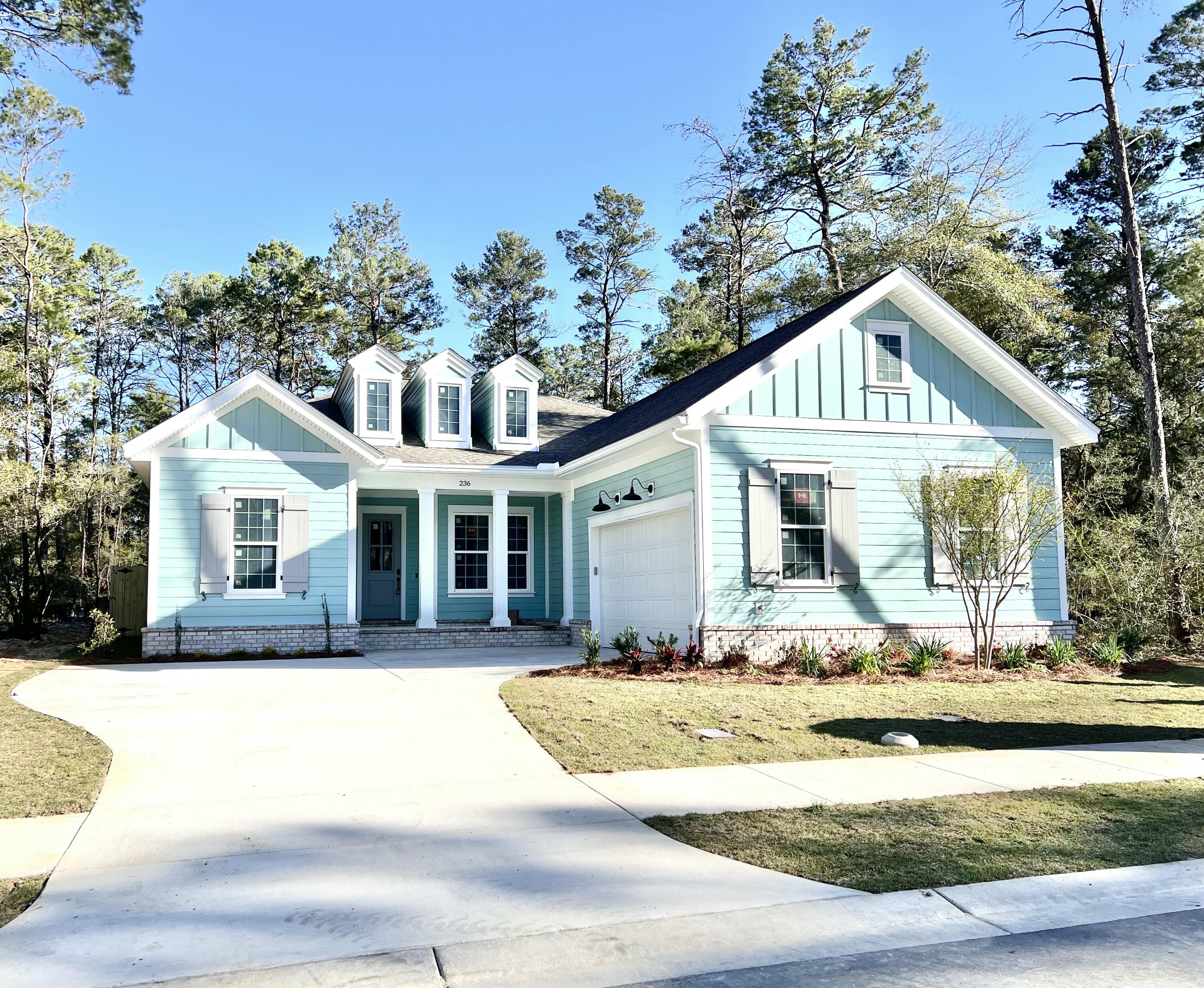 Gorgeous new 4 bedroom, 3 bath home in Niceville's beautiful community Deer Moss Creek Phase 11! Deer Moss Creek is a master planned, front porch community with charming, single family homes and commercial properties all set amongst tree lined lots, walking paths, parks and more. This beautiful home features 2513 sqft of living area including a front porch and a large lanai. This beauty offers a spacious family room, beautiful kitchen with a gas stove, stainless steel appliances, white shaker cabinetry, a large center island, breakfast nook and a separate flex room that can be used as a formal dining room or office. The split floor plan has the master suite on one side and 3 additional bedrooms and 2 full bathrooms on the opposite side. The master bathroom has a tub and a shower and the master walk in closet connect with the spacious laundry room.
The upgrades on this home includes:
- Herringbone Brick - Front Porch
- Smart Belt Driven Garage Opener
- Digital "Smart" Thermostat
- All Interior/Exterior Finishes on Lights/Plumb/HW/Etc. = Matte Black
- Rain Can Shower Head in Master Shower
- Full Cased Windows
- Built-in Added into Mudroom Area
- Front Door Hardware - Belleview Handleset with Touchless Entry Deadbolt
- White Melamine Custom Shelving in Guest Closets, Linens and Master Closet
- Wood Shelving in Pantry
- French Door Refrigerator
- Upgraded Cabinet Hardware
- Upgraded Quartz Countertops
- Flooring will be LVP and tile in the wet areas.
Estimated completion April.